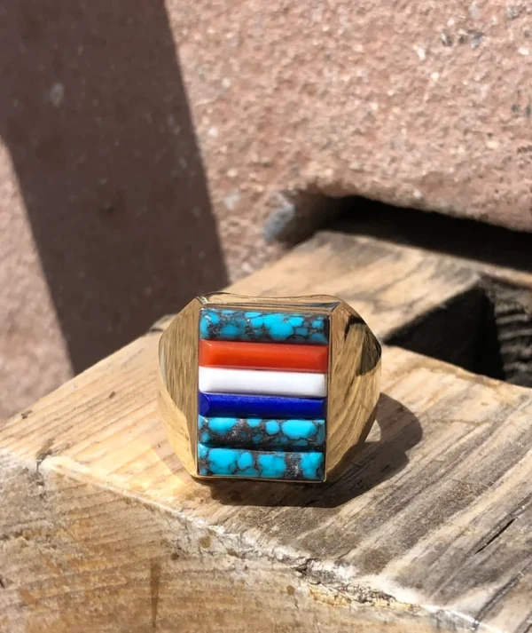 A ring with some kind of colorful stone on it