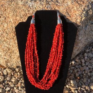 A necklace of red coral and silver beads.