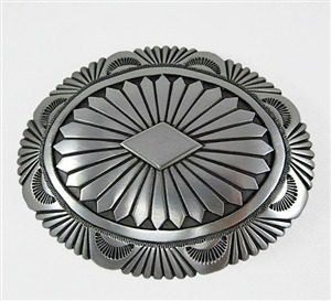 A silver belt buckle with a diamond shaped center.