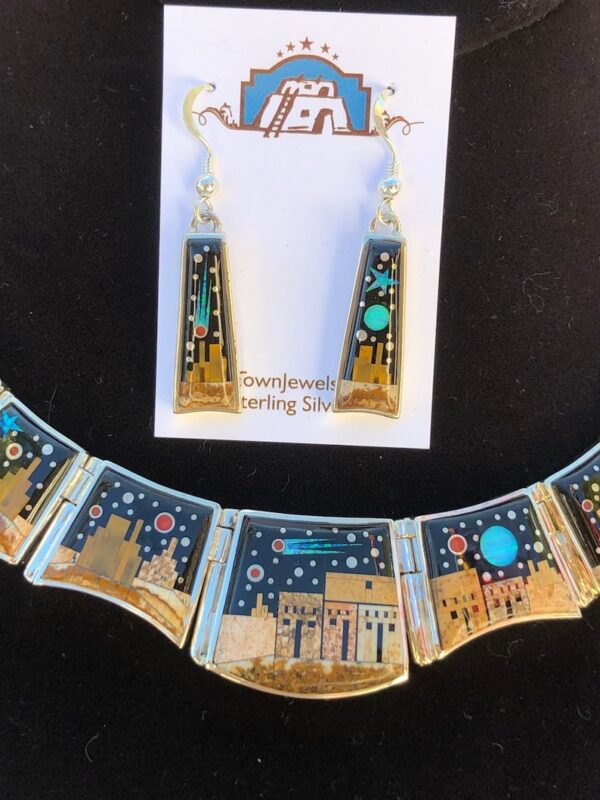 A necklace and earrings set with the desert scene.