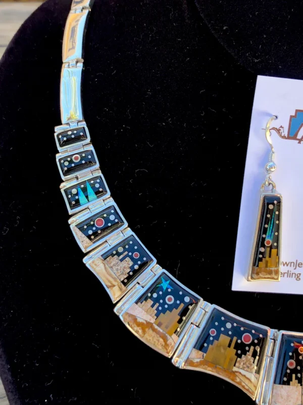 A necklace with many different colored tiles on it