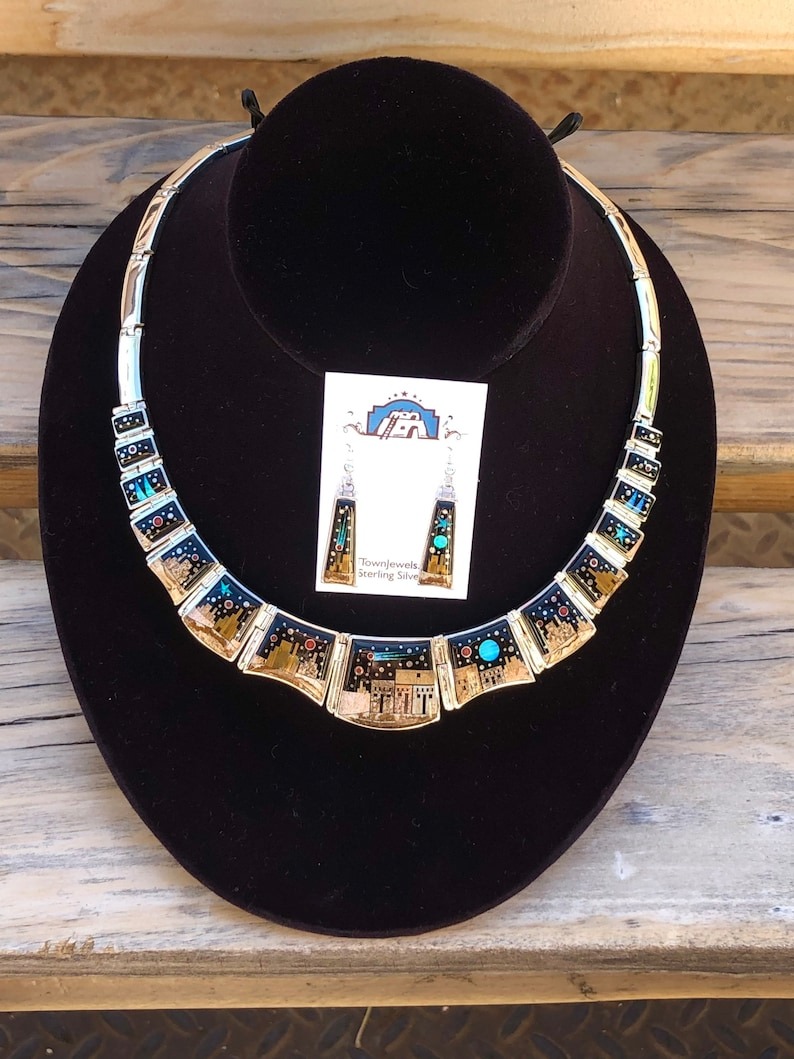 A necklace and earrings set on display in a store.