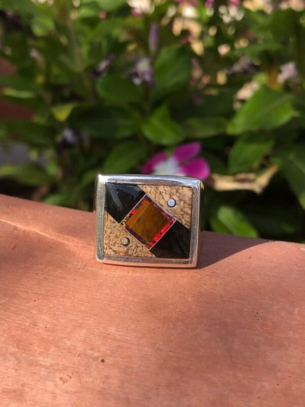 A square ring with a colorful design on it's side.