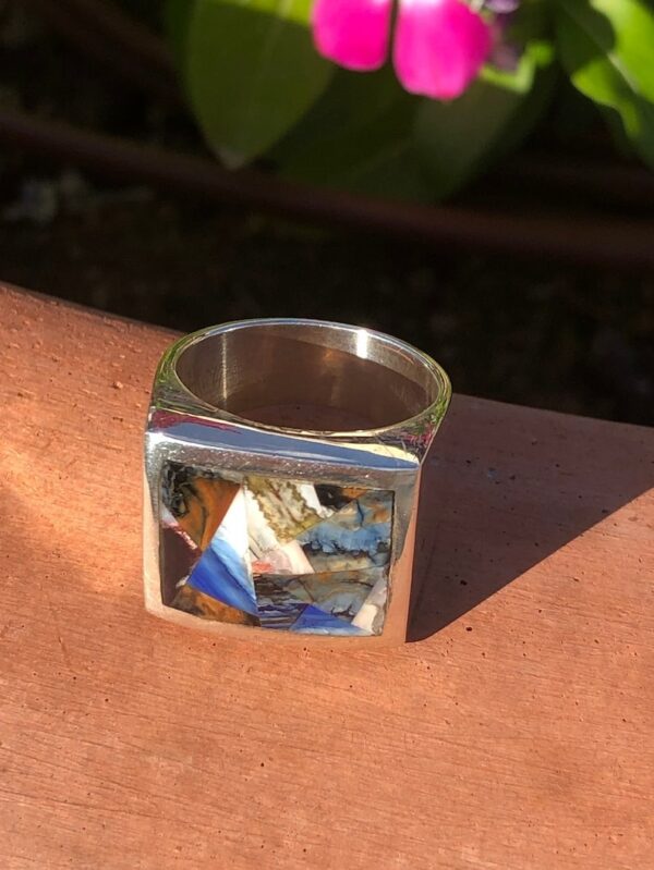 A square ring with a picture of a person on it.