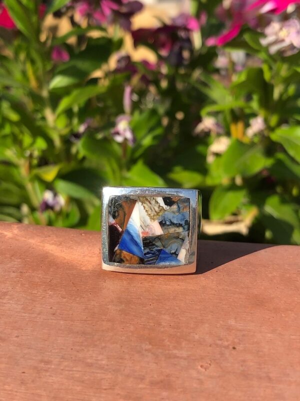 A square ring with a picture of a person on it.