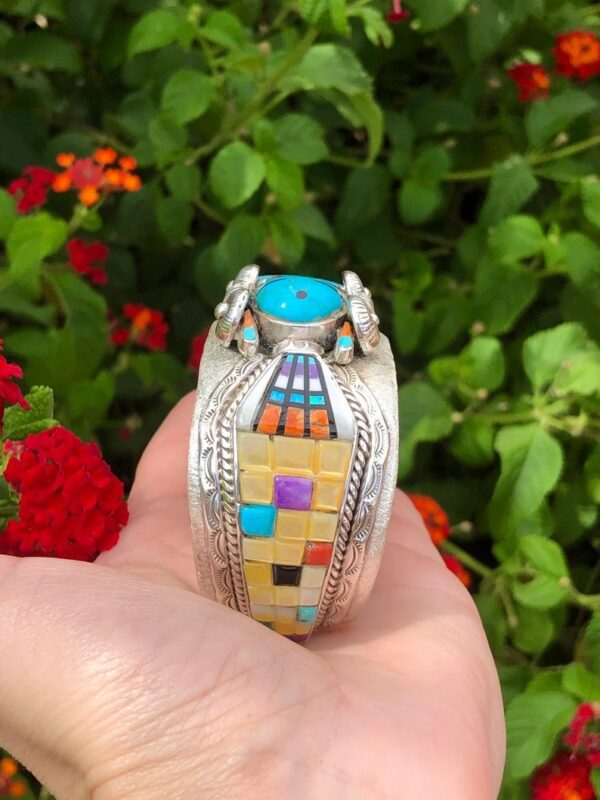 A person holding onto a colorful ring