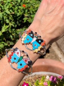 A pair of bracelets with colorful designs on them.