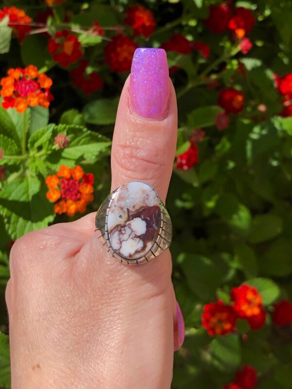 Silver ring with brown and white stone.