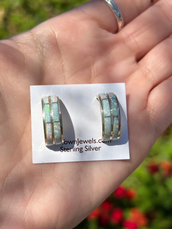 Sterling silver opal hoop earrings.