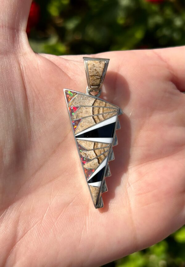 A Native American style inlaid gemstone pendant.