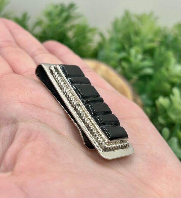 Sterling silver money clip with black onyx inlay.