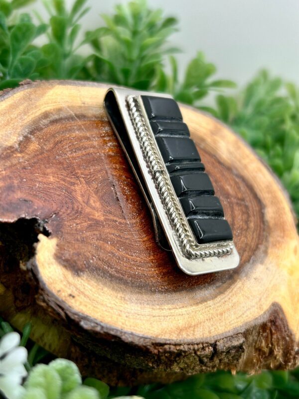 Sterling silver money clip with black onyx inlay.