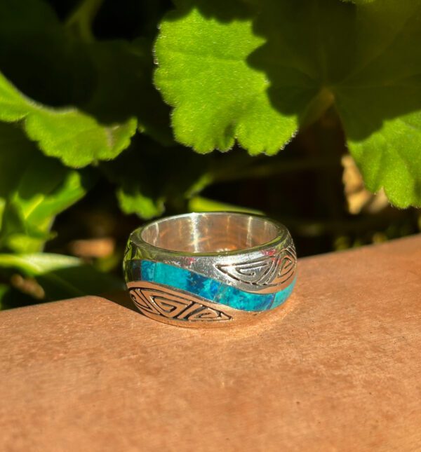 Sterling silver ring with blue inlay.