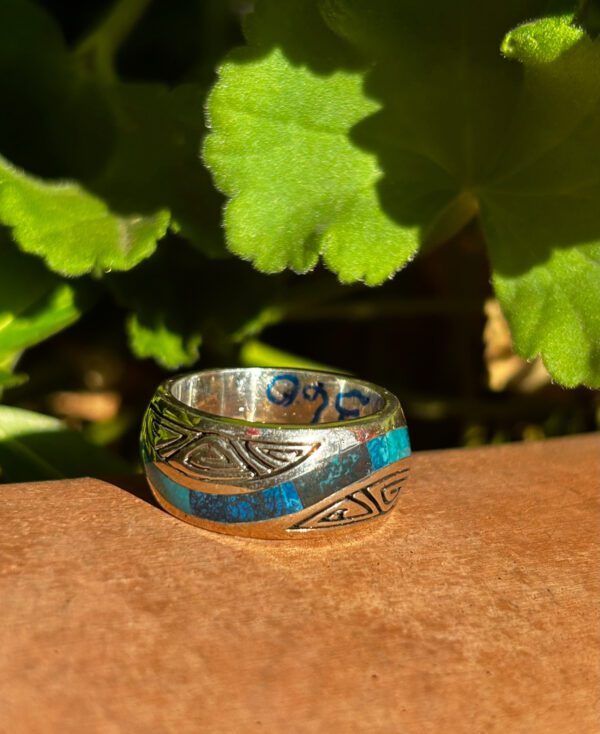 Sterling silver ring with blue inlay.