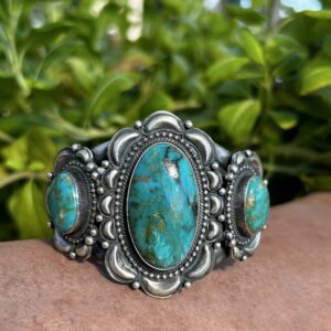 Silver turquoise bracelet with three stones.