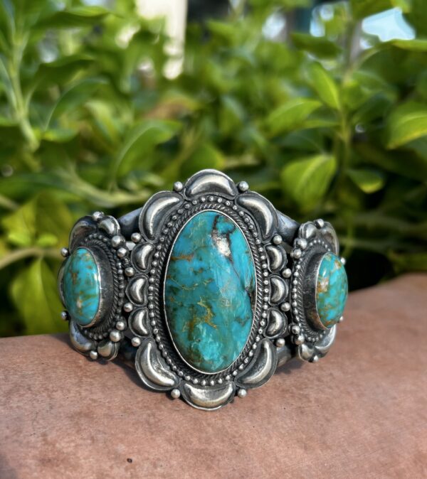 Silver turquoise bracelet with three stones.